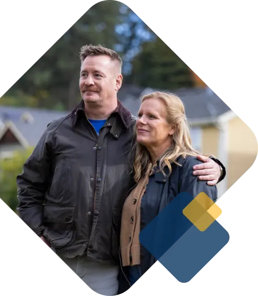 Man with arm around woman.